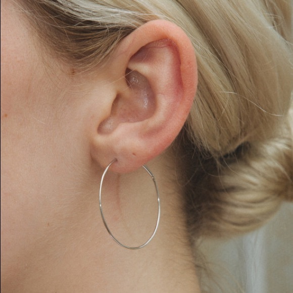 Brandy Melville Jewelry - Thin silver hoop earrings, endless loop closure.